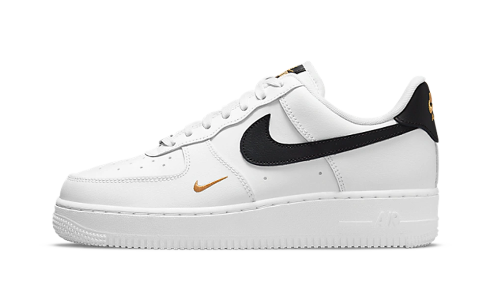 Foto del prodotto Nike Air Force 1 Low '07 Essential White Black Gold Mini Swoosh (W)